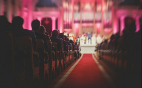 People watching performance in theater